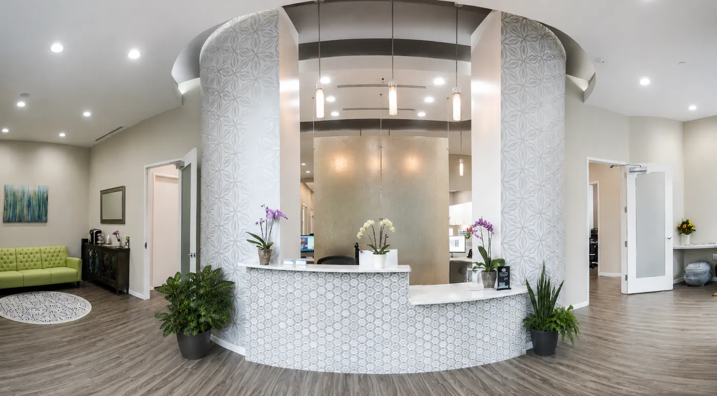The modern, spa-like reception area at Smile Beautiful Dental in Washington, DC
